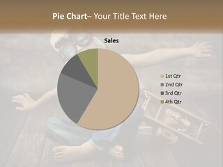 A Young Boy In A Hat And Scarf Sitting On A Wooden Floor PowerPoint Template