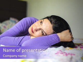 A Woman Laying On A Bed With Her Hands On Her Head PowerPoint Template