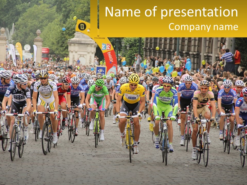 A Group Of People Riding Bikes Down A Street PowerPoint Template