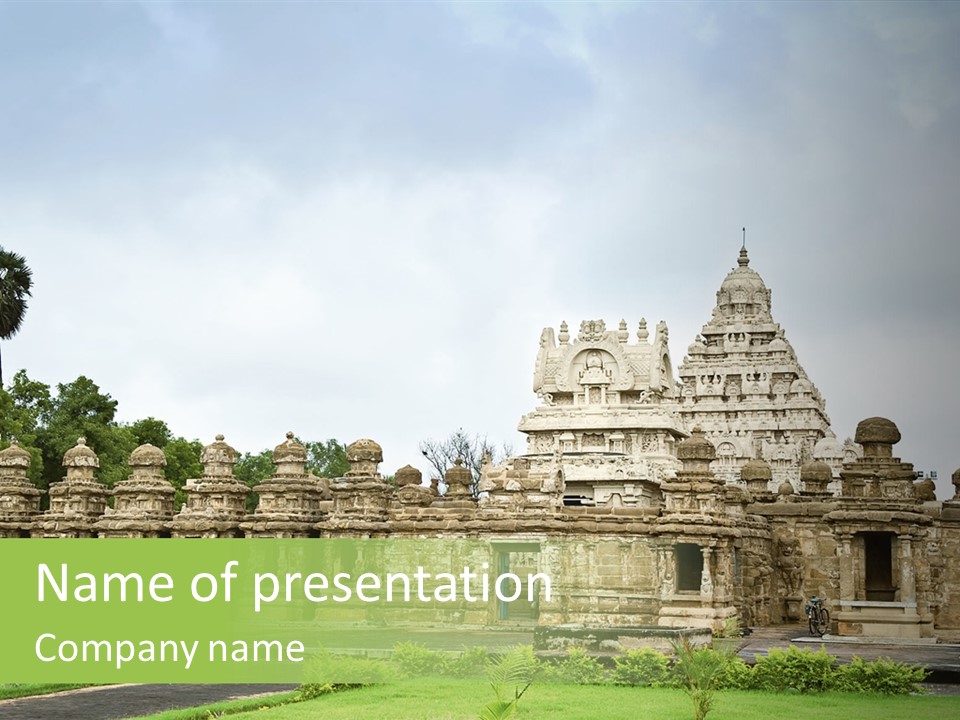 A Large Stone Structure With A Palm Tree In The Foreground PowerPoint Template
