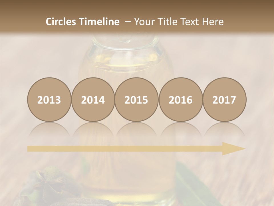 A Bottle Of Oil With A Green Leaf On A Wooden Table PowerPoint Template