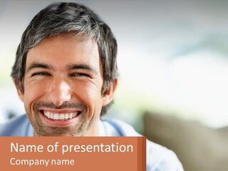 A Man Smiling With A Business Card In Front Of Him PowerPoint Template