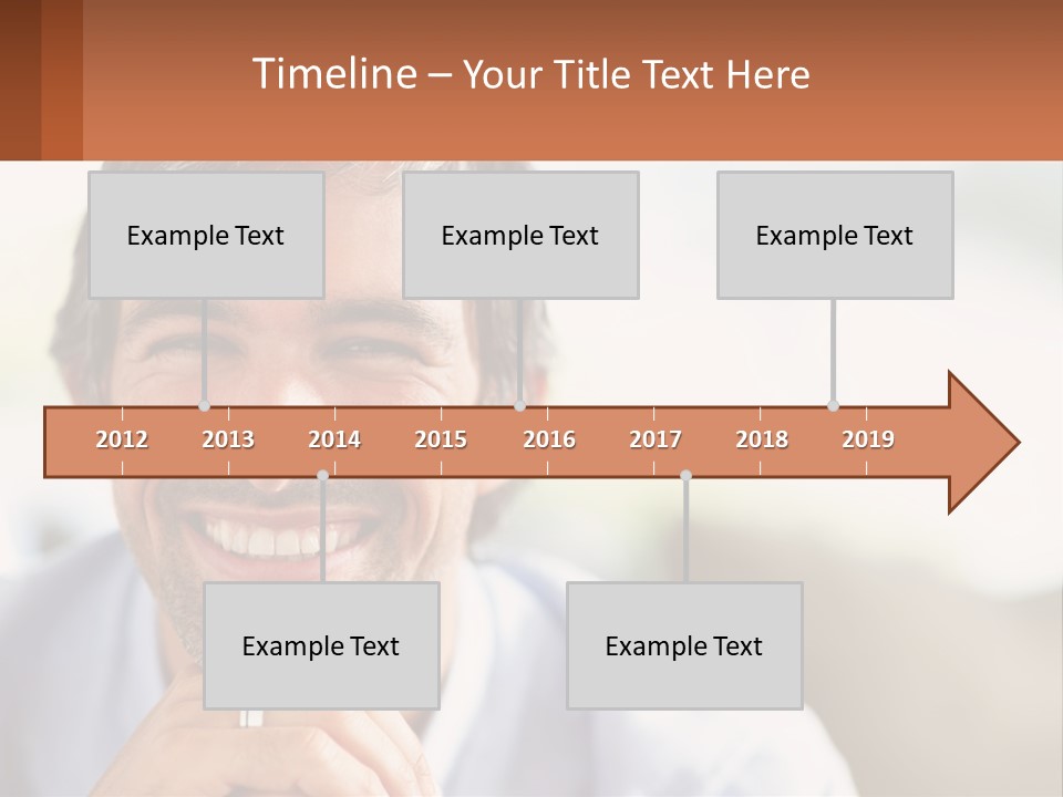 A Man Smiling With A Business Card In Front Of Him PowerPoint Template