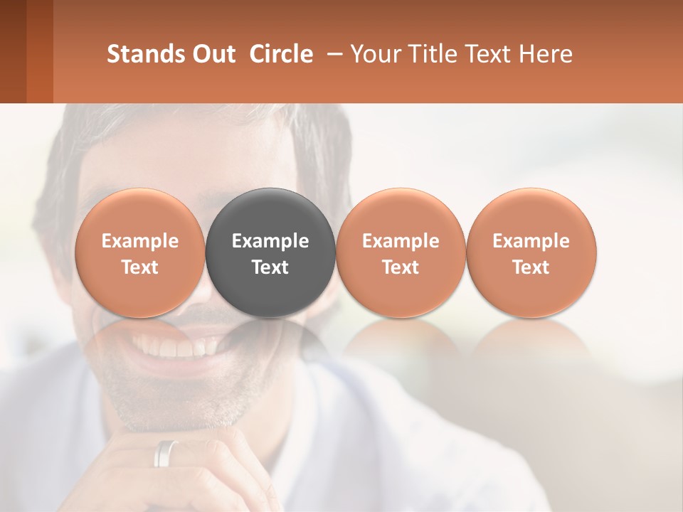 A Man Smiling With A Business Card In Front Of Him PowerPoint Template