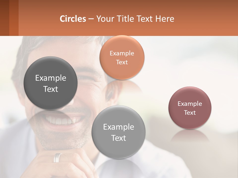 A Man Smiling With A Business Card In Front Of Him PowerPoint Template