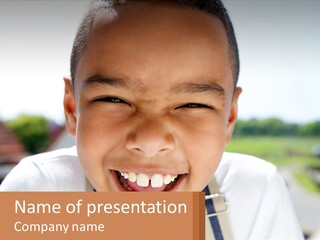 A Young Boy Smiling With His Mouth Open PowerPoint Template