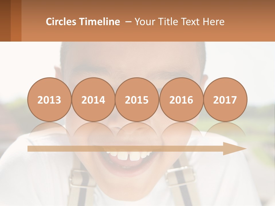 A Young Boy Smiling With His Mouth Open PowerPoint Template