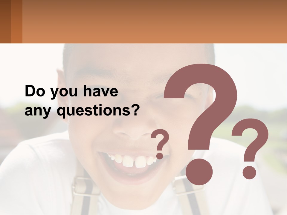 A Young Boy Smiling With His Mouth Open PowerPoint Template