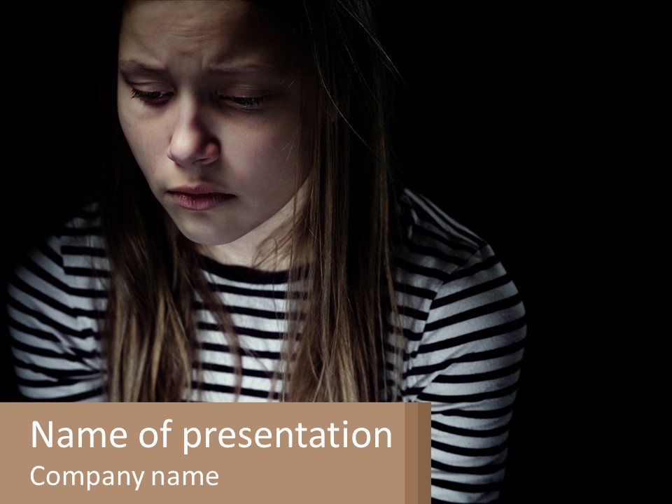 A Young Girl Is Looking At Her Cell Phone PowerPoint Template