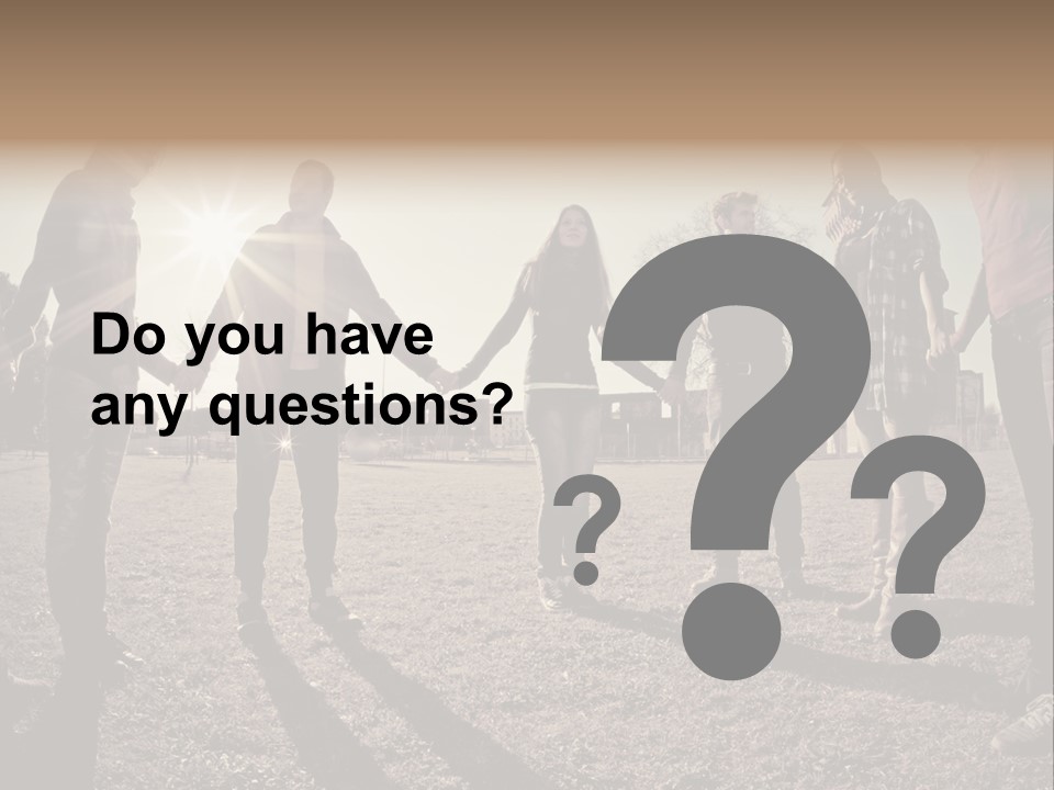 A Group Of People Holding Hands In A Field PowerPoint Template