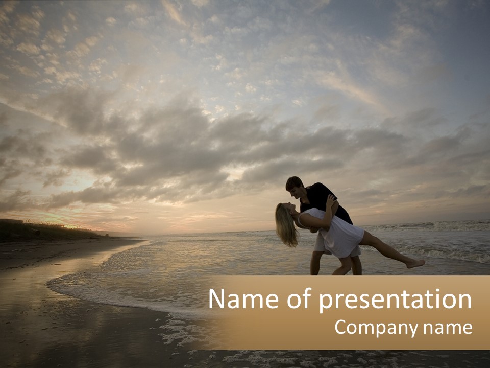 A Man And A Woman Are Kissing On The Beach PowerPoint Template