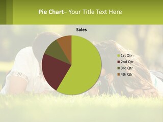 A Family Laying On The Grass In A Park PowerPoint Template