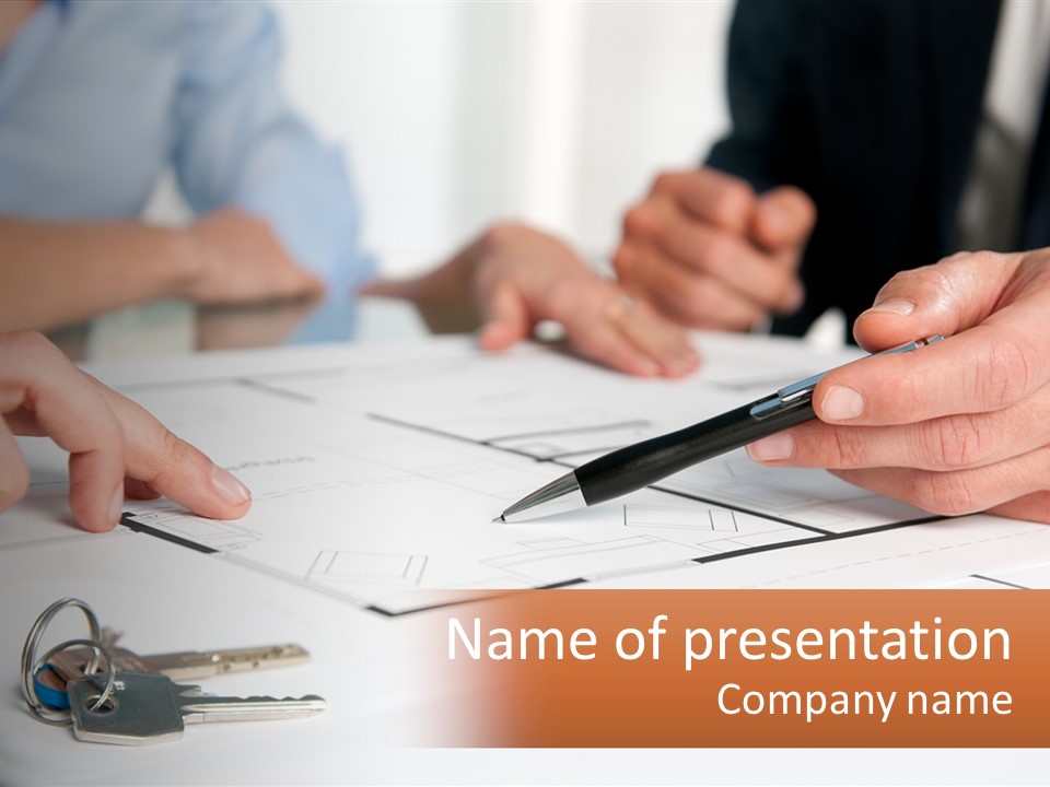 A Group Of People Sitting Around A Table With Keys PowerPoint Template