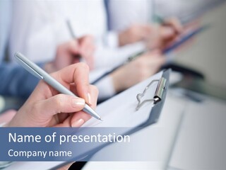A Person Writing On A Piece Of Paper With A Pen PowerPoint Template