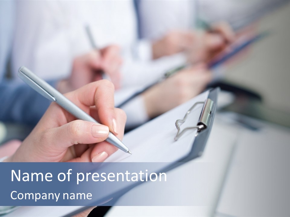 A Person Writing On A Piece Of Paper With A Pen PowerPoint Template