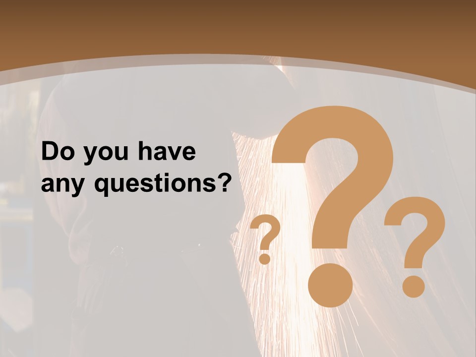 A Man Working On A Piece Of Metal In A Factory PowerPoint Template