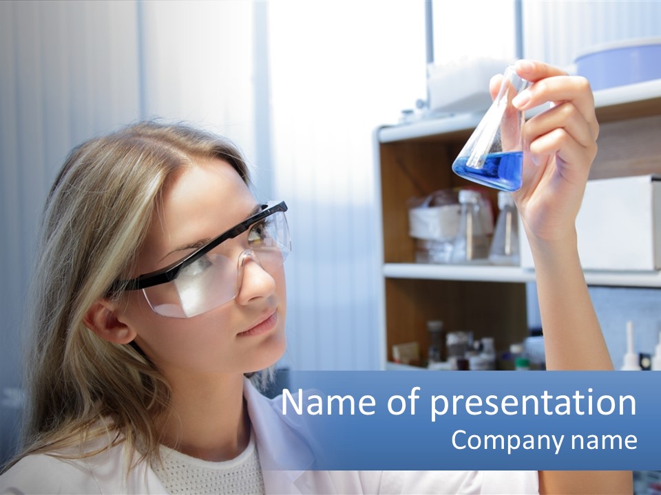 A Woman In Glasses Holding A Flask Of Blue Liquid PowerPoint Template