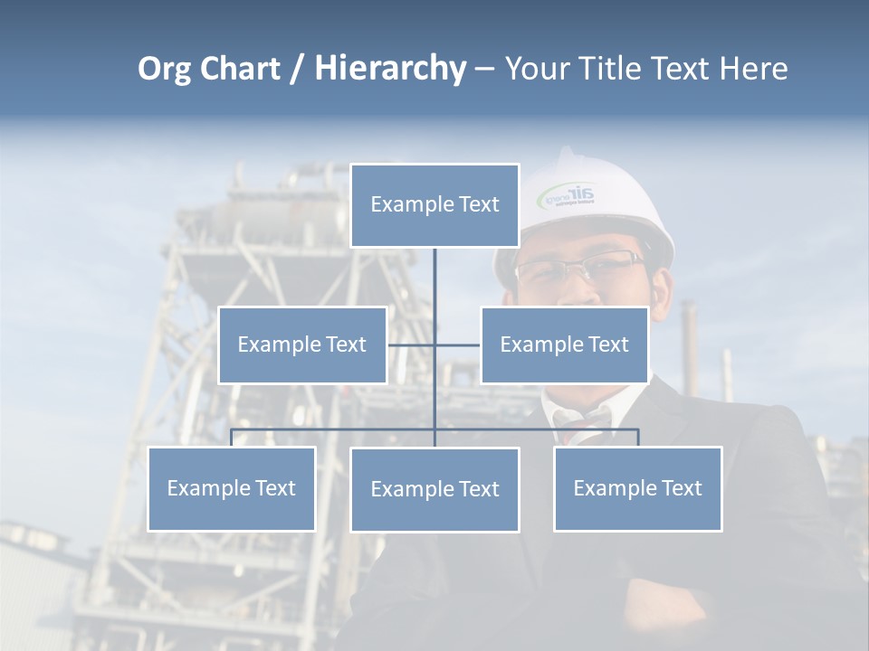 A Man Wearing A Hard Hat Standing In Front Of A Power Plant PowerPoint Template