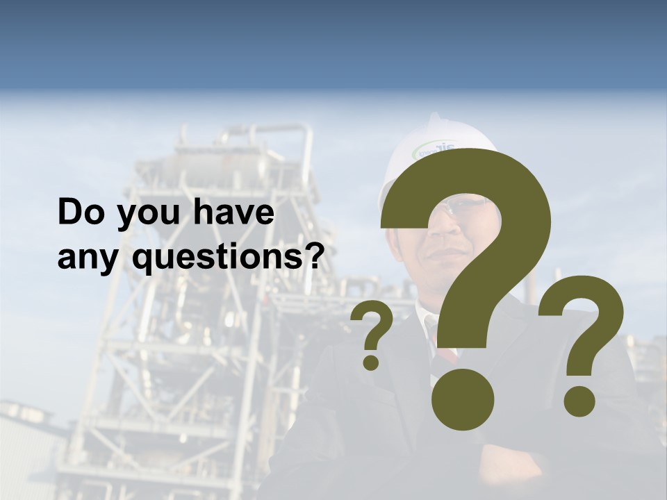 A Man Wearing A Hard Hat Standing In Front Of A Power Plant PowerPoint Template