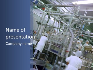 A Factory Filled With Lots Of Machines And Workers PowerPoint Template