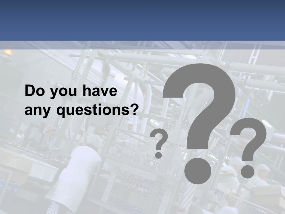 A Factory Filled With Lots Of Machines And Workers PowerPoint Template