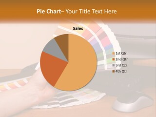 A Person Holding A Color Swater Over A Computer Screen PowerPoint Template