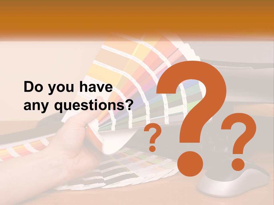 A Person Holding A Color Swater Over A Computer Screen PowerPoint Template