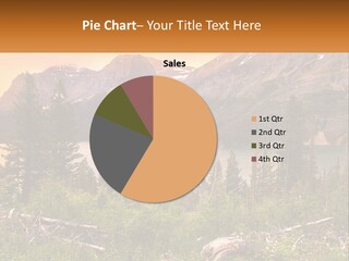 A Mountain Lake Surrounded By Trees And Mountains PowerPoint Template