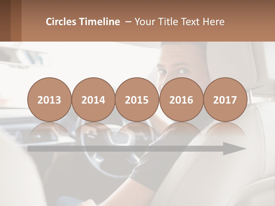 A Man Sitting In A Car With A Steering Wheel PowerPoint Template