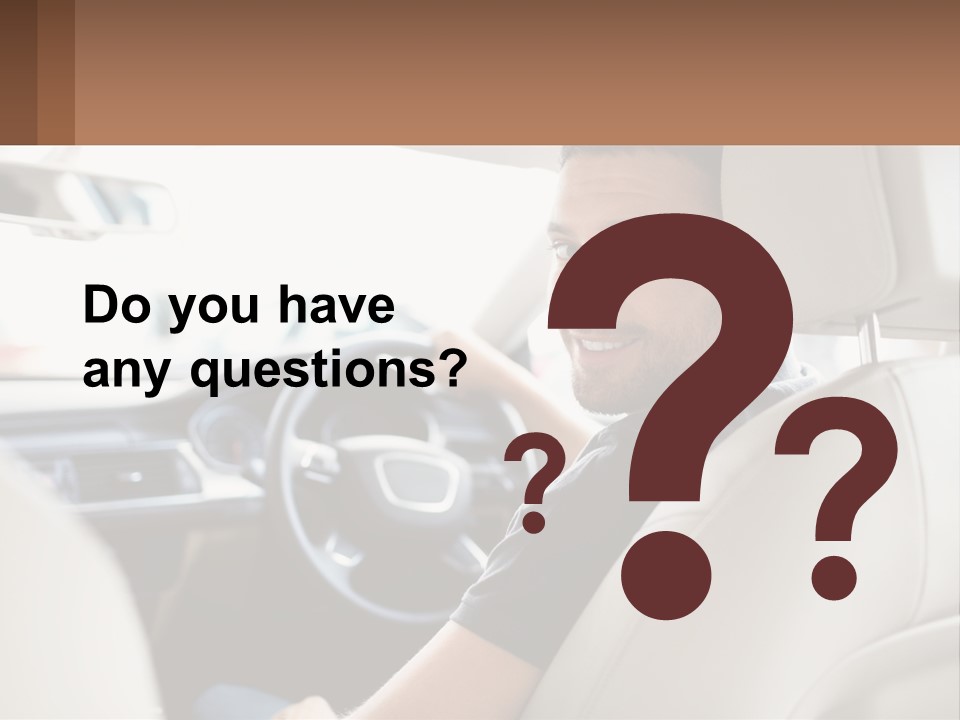 A Man Sitting In A Car With A Steering Wheel PowerPoint Template