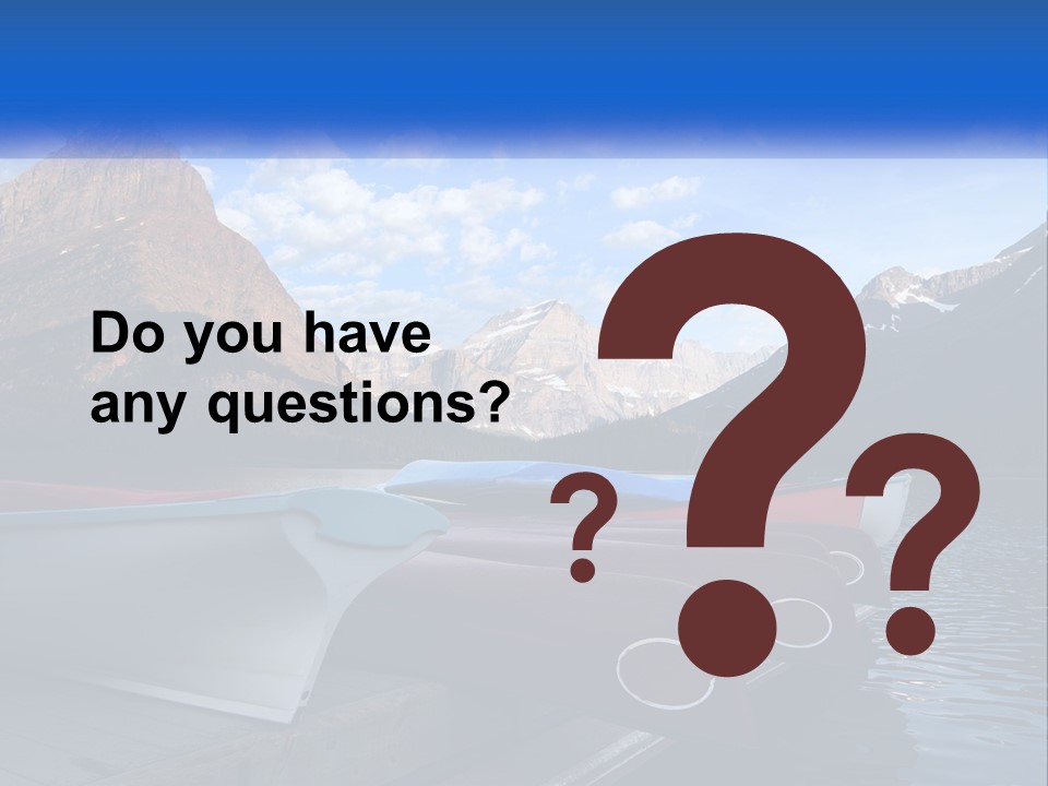 A Row Of Canoes On A Lake With Mountains In The Background PowerPoint Template