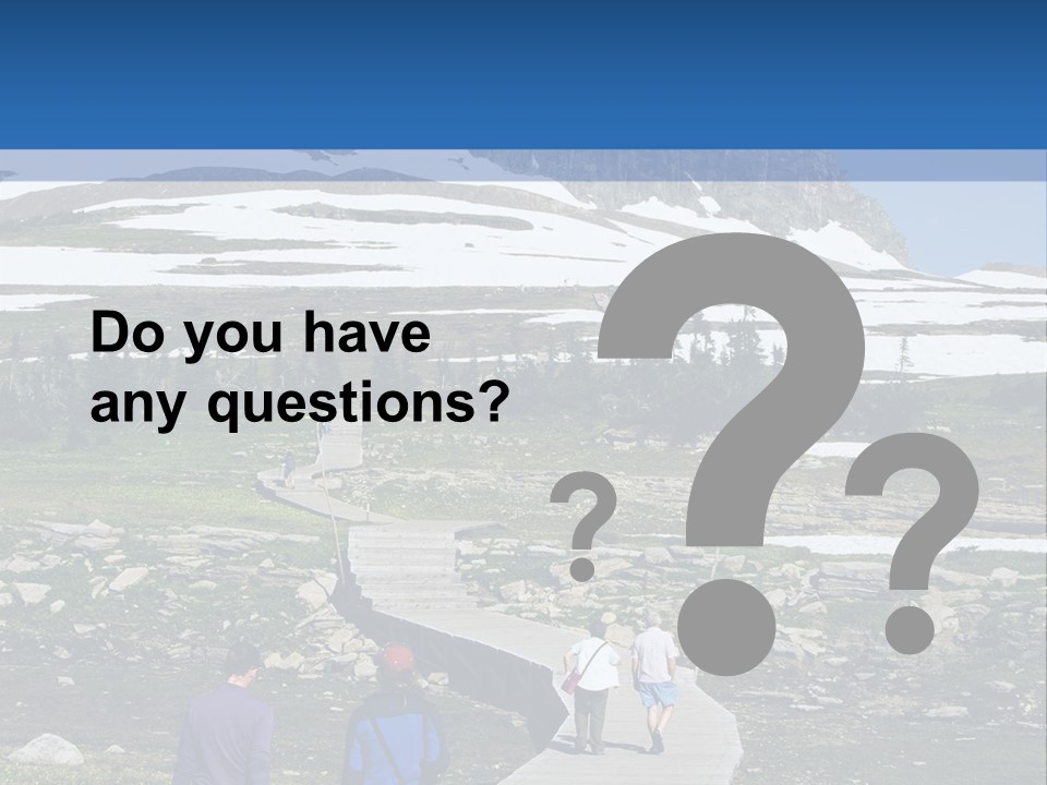 A Group Of People Walking Down A Path Towards A Mountain PowerPoint Template