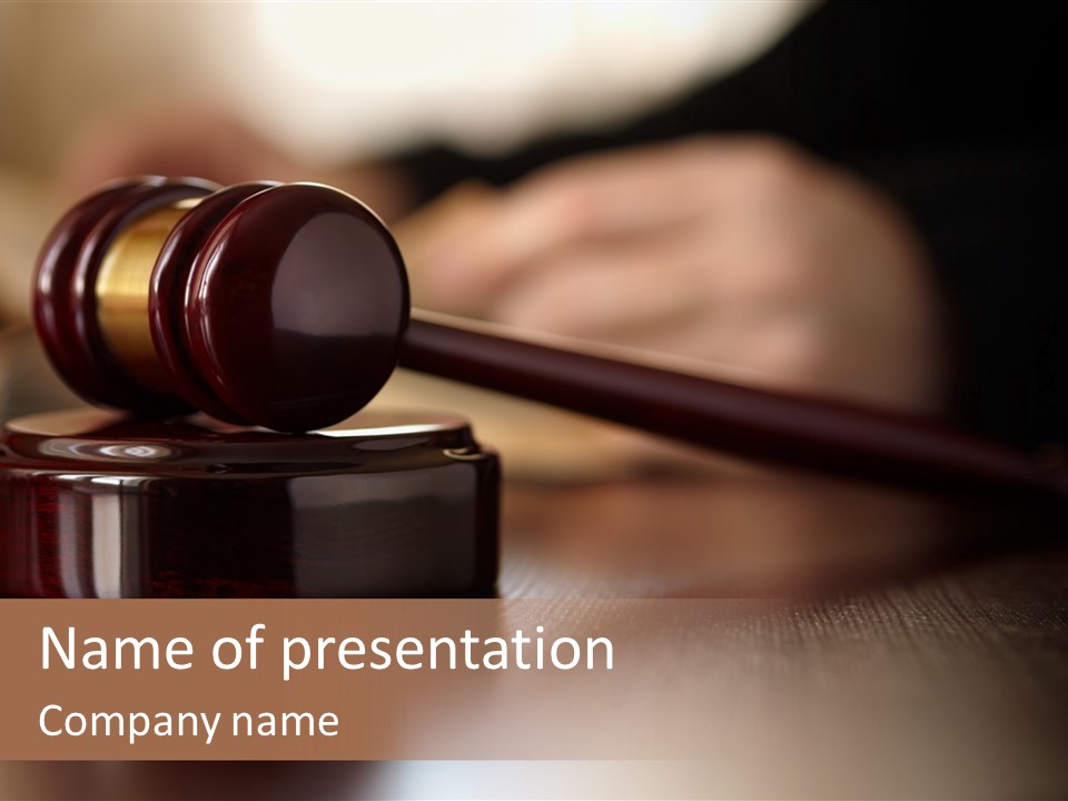 A Wooden Judge's Gavel On A Table With A Person In The Background PowerPoint Template
