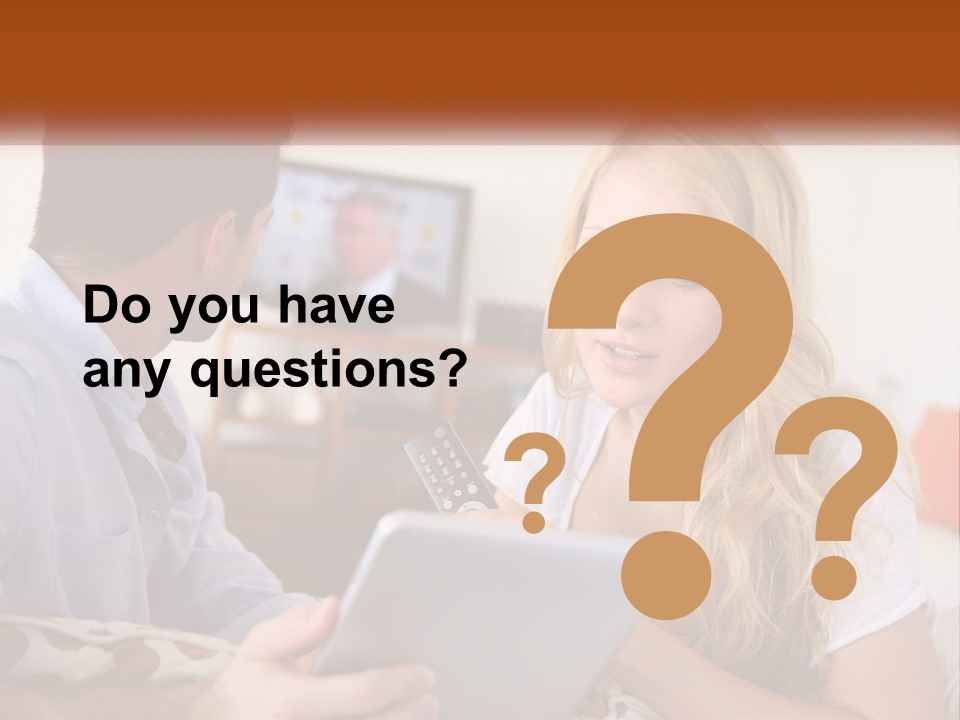 A Man And A Woman Sitting In Front Of A Television PowerPoint Template