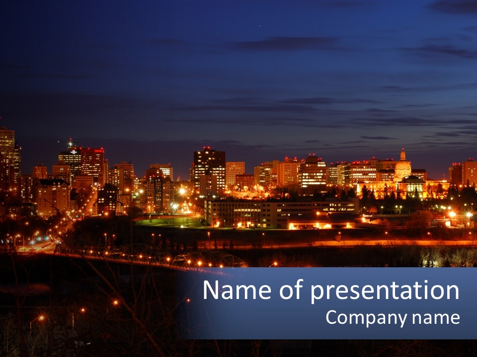 A City Skyline At Night With The Lights On PowerPoint Template