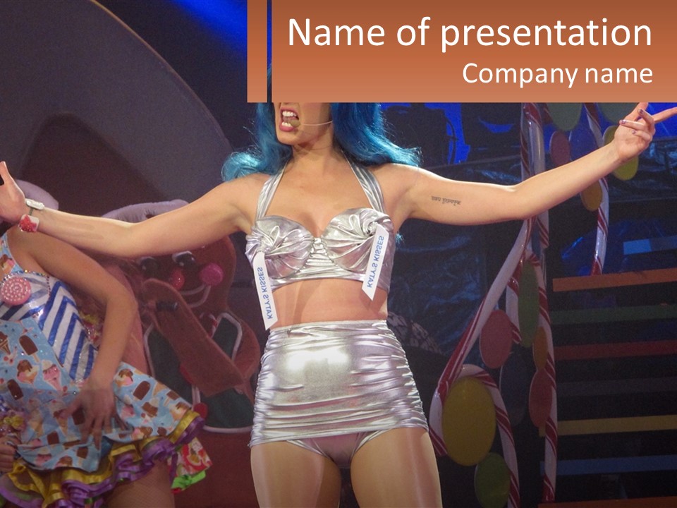 A Woman In A Silver Outfit On Stage PowerPoint Template