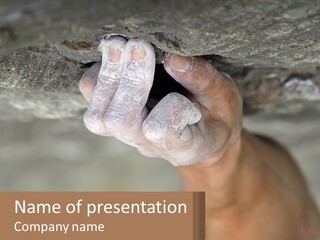 A Person Is Holding Their Hand Up To A Rock PowerPoint Template