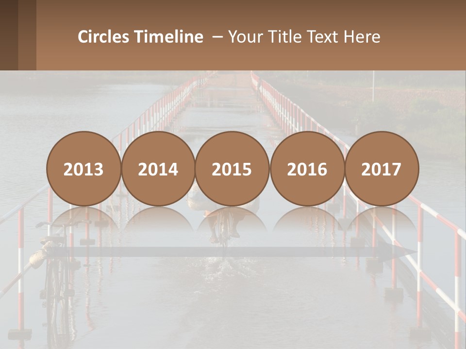 A Person Riding A Bike Across A Flooded Bridge PowerPoint Template