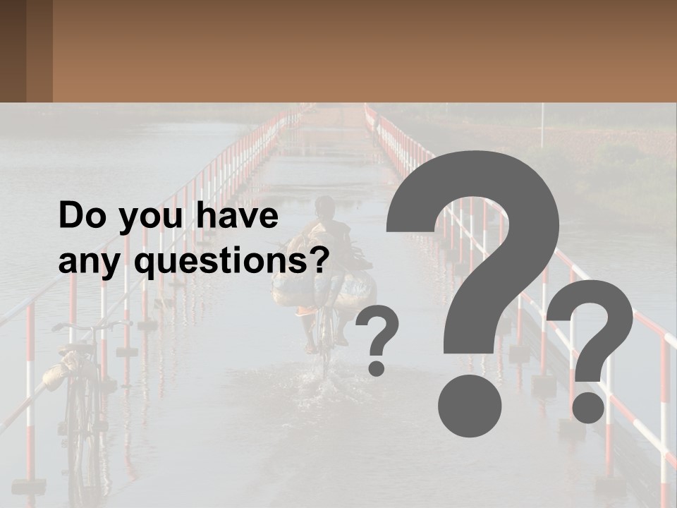 A Person Riding A Bike Across A Flooded Bridge PowerPoint Template