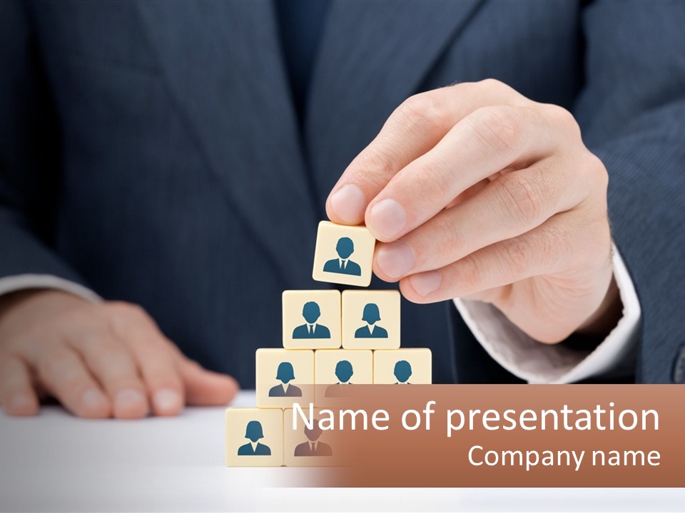 A Man In A Suit Placing Blocks On Top Of A Table PowerPoint Template