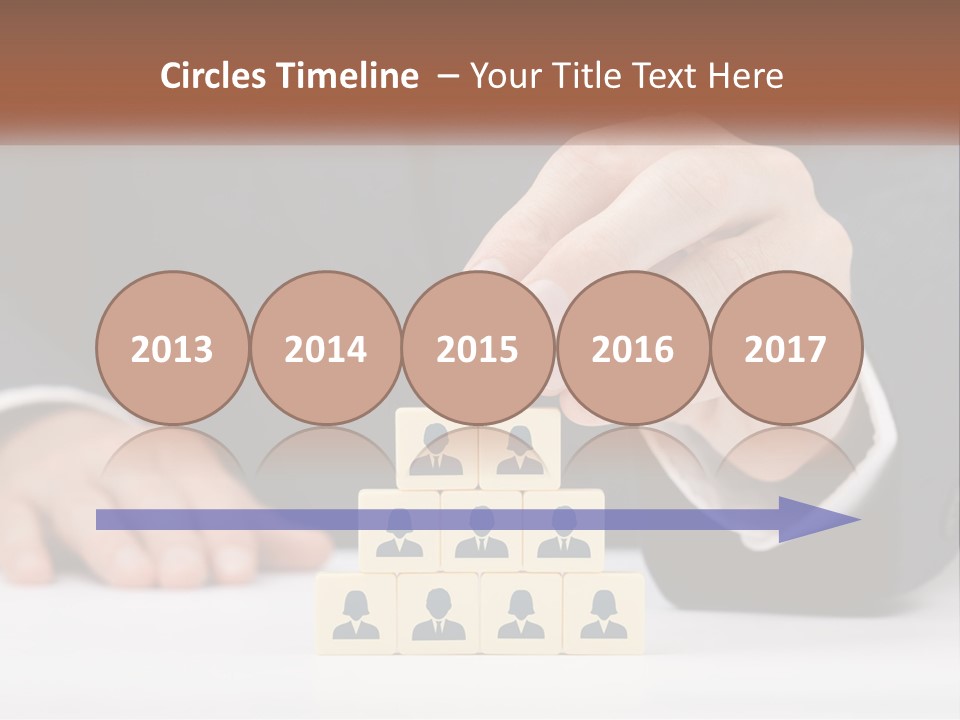 A Man In A Suit Placing Blocks On Top Of A Table PowerPoint Template