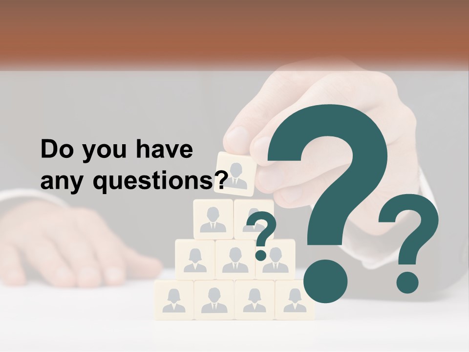 A Man In A Suit Placing Blocks On Top Of A Table PowerPoint Template