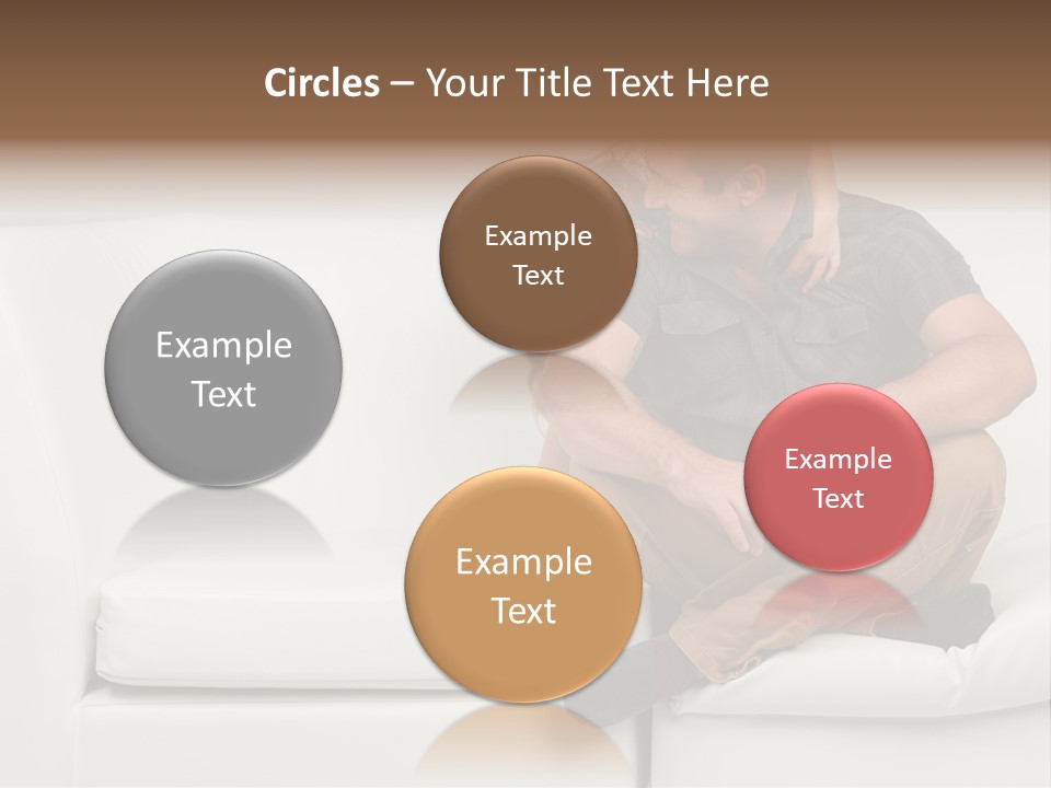 A Man And A Woman Sitting On A White Couch PowerPoint Template