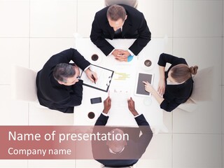 A Group Of People Sitting Around A Table PowerPoint Template