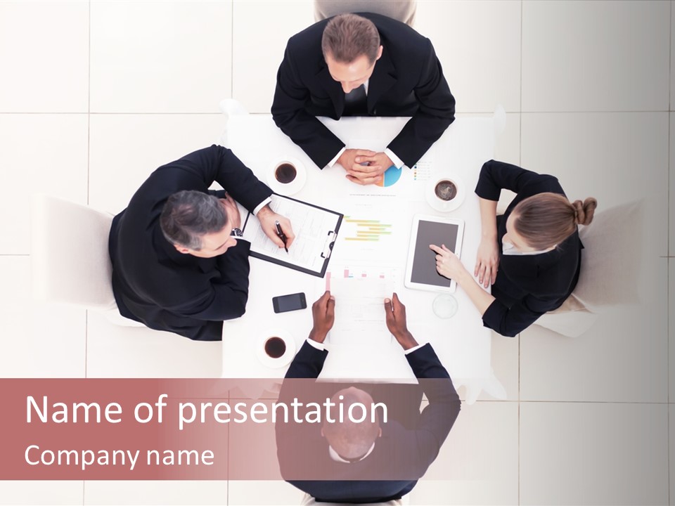 A Group Of People Sitting Around A Table PowerPoint Template