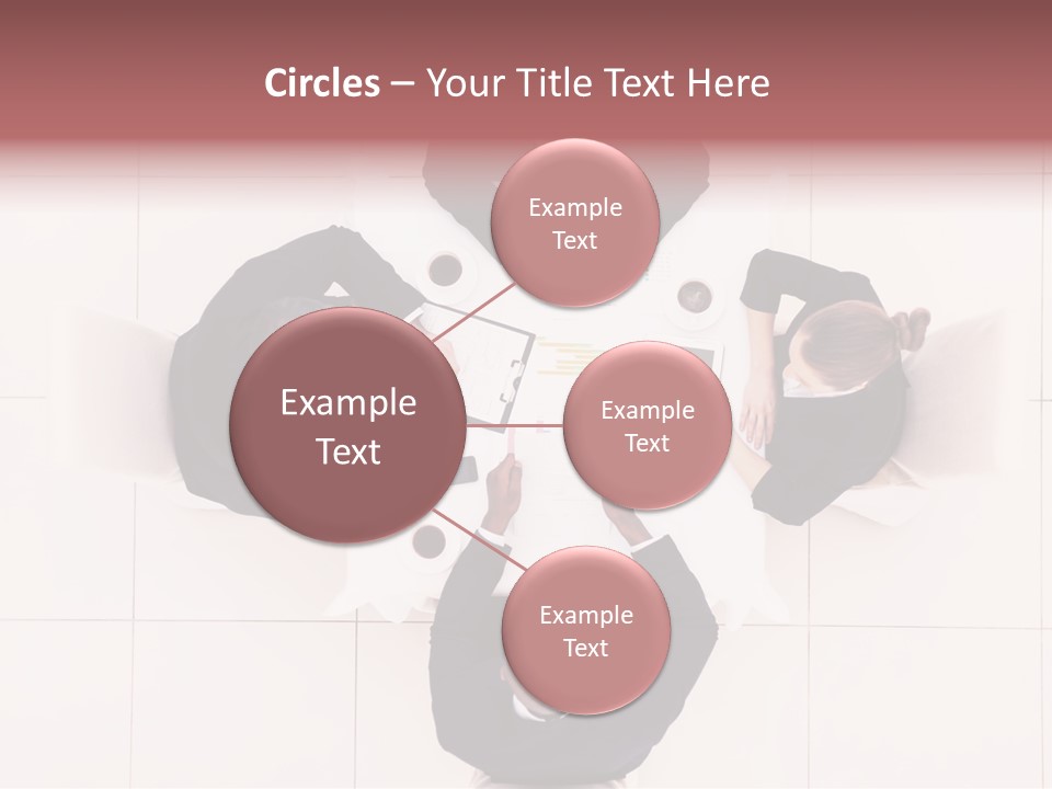 A Group Of People Sitting Around A Table PowerPoint Template