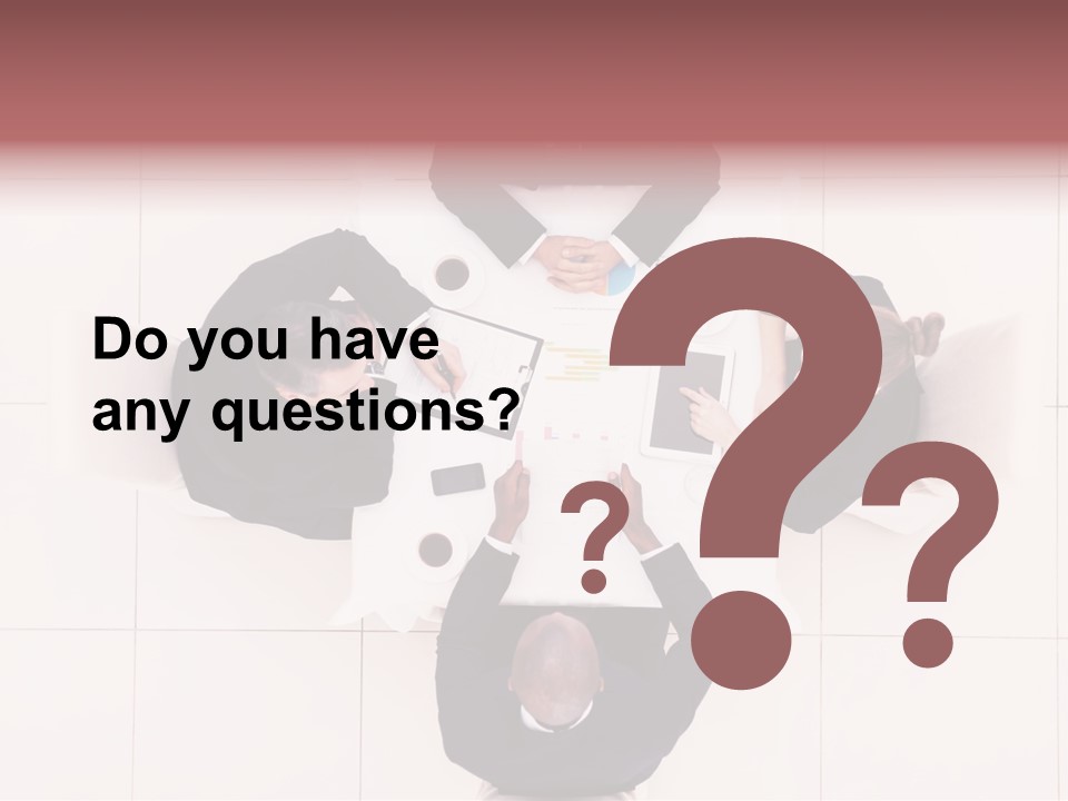 A Group Of People Sitting Around A Table PowerPoint Template