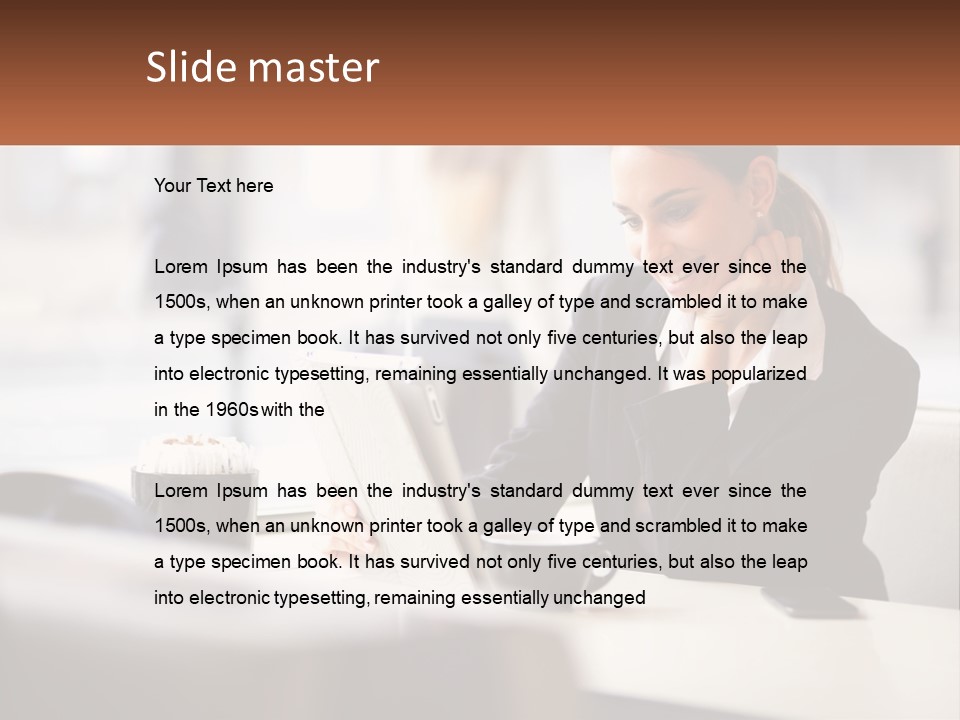 A Woman Sitting At A Table Using A Laptop Computer PowerPoint Template