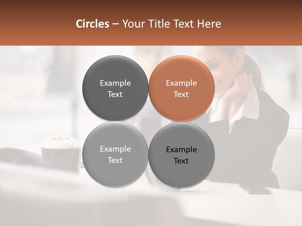 A Woman Sitting At A Table Using A Laptop Computer PowerPoint Template