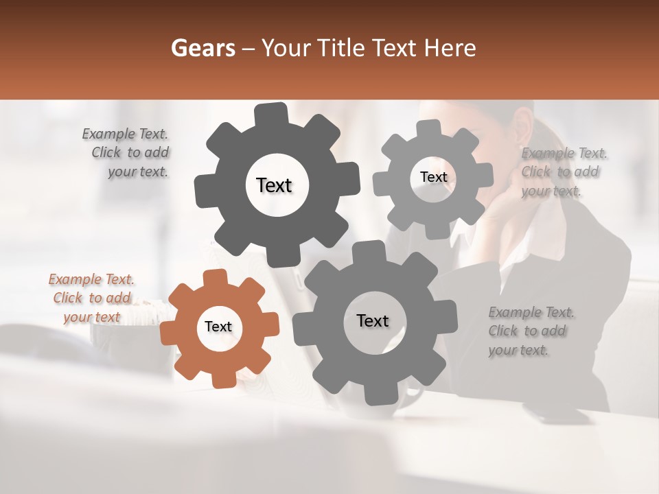 A Woman Sitting At A Table Using A Laptop Computer PowerPoint Template